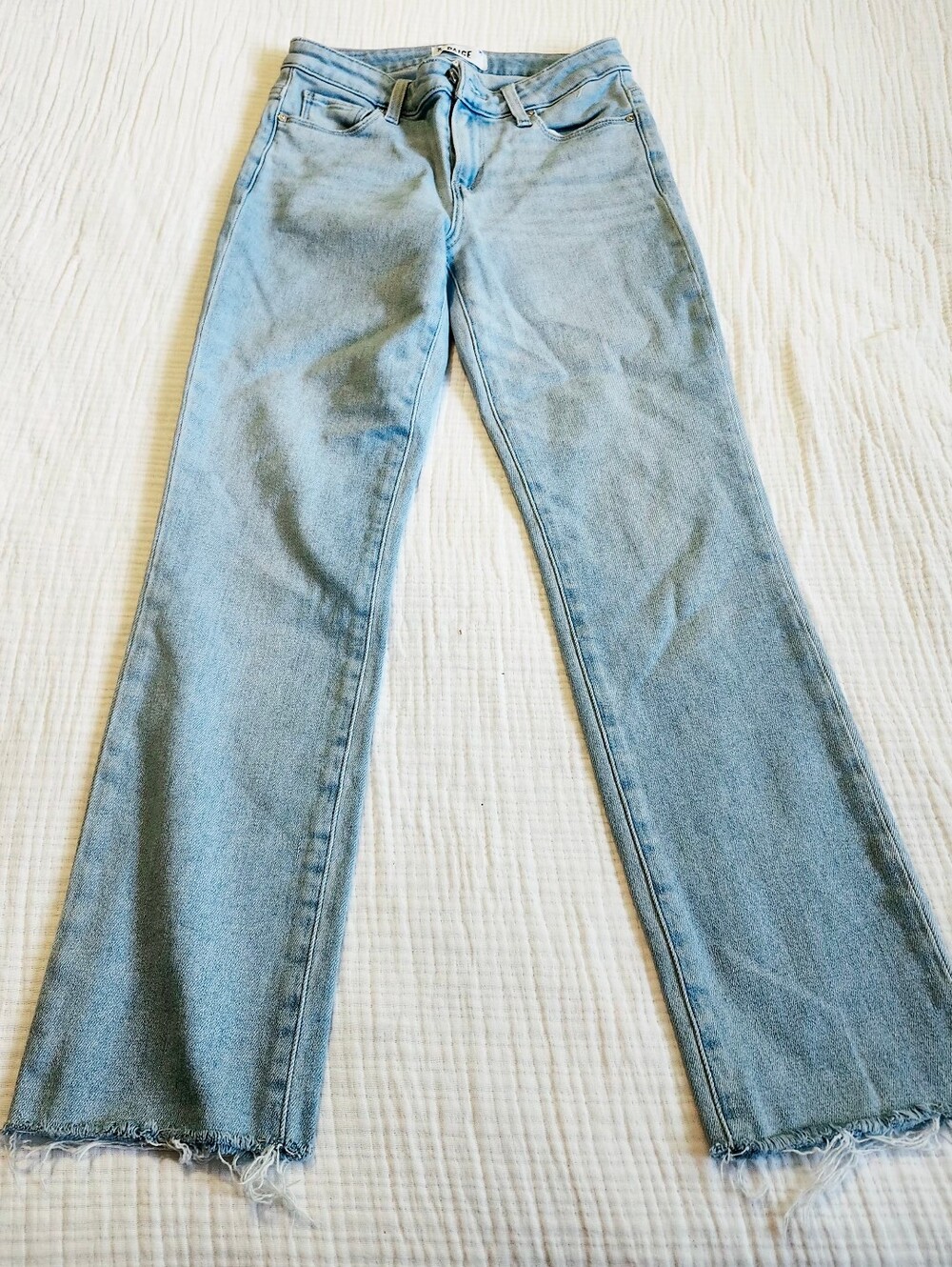 PAIGE Light Wash Flared Jeans with Frayed Hem